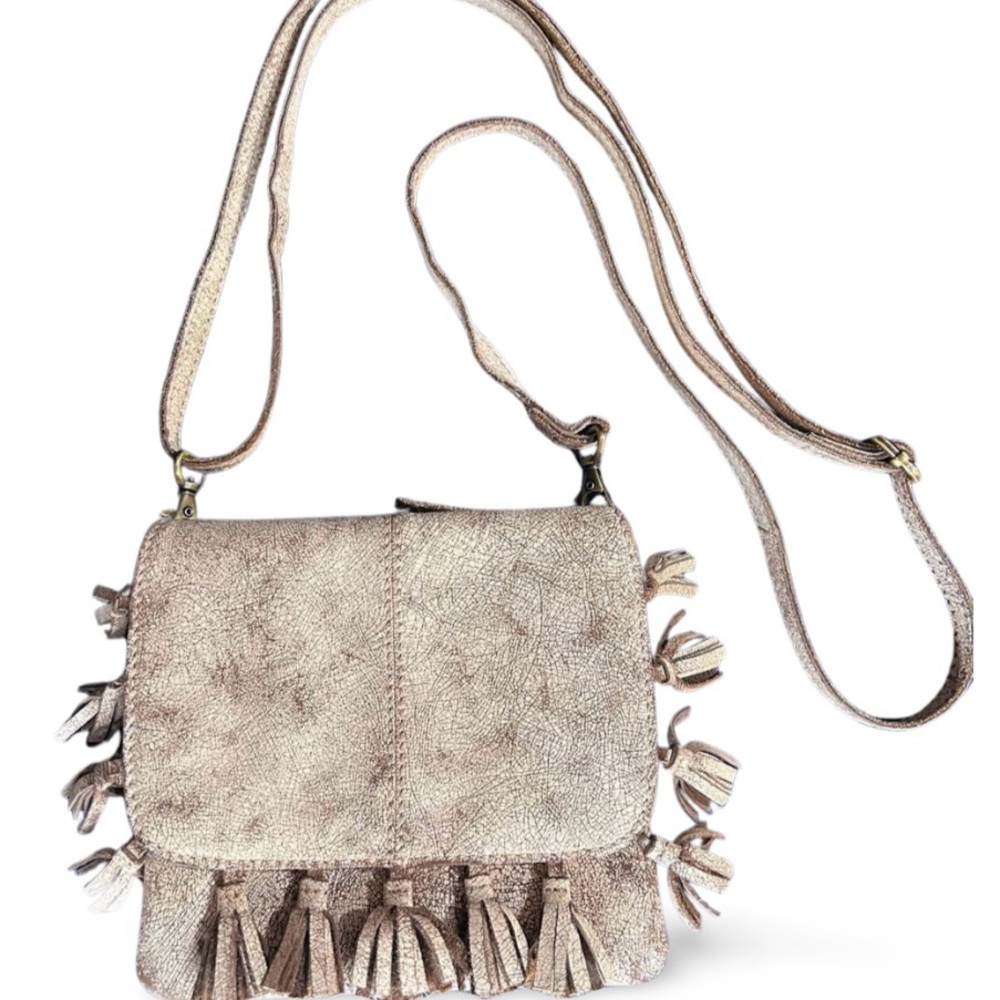 Latico distressed crème crossbody with fringe tassels